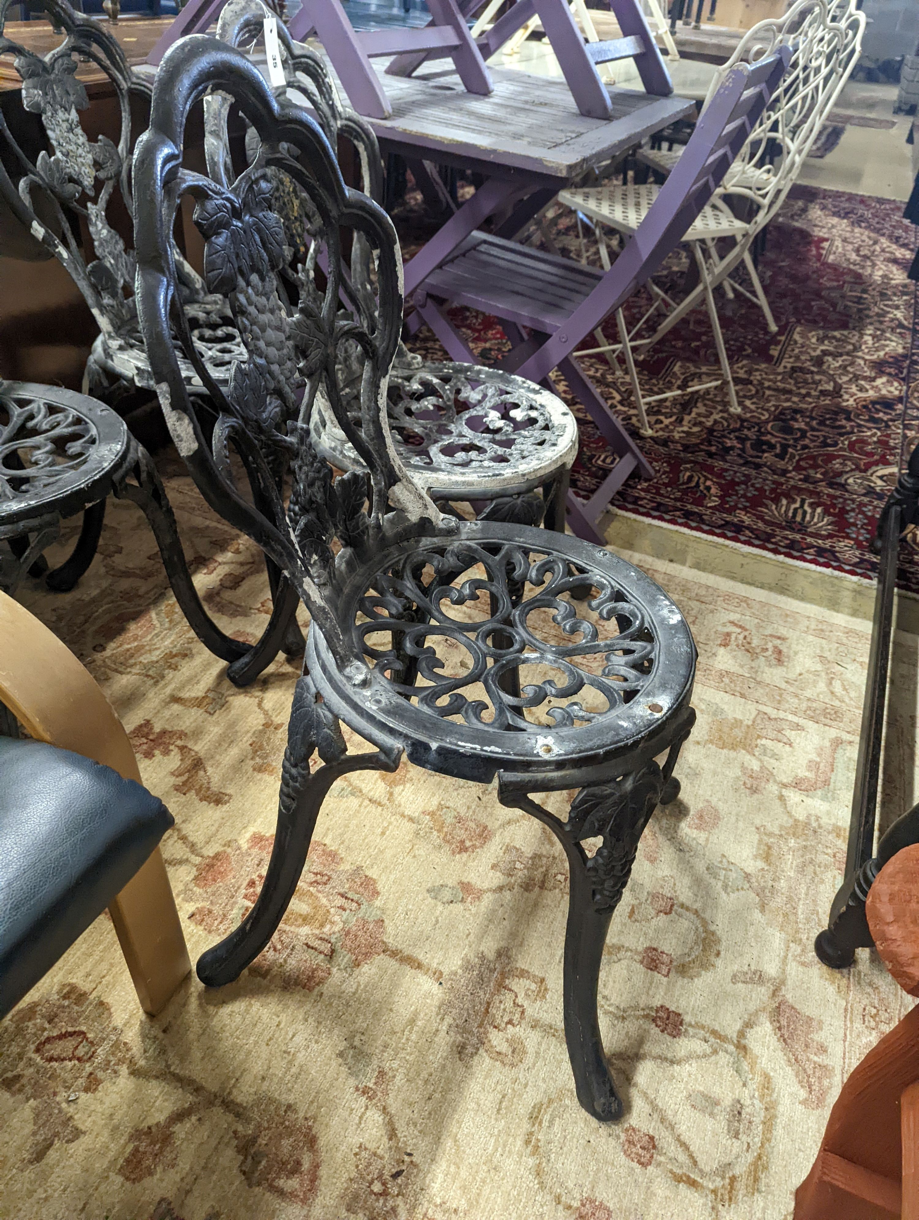 A set of four aluminium garden chairs